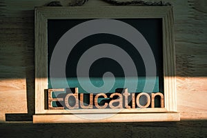 Education alphabet Wooden letters on mini blackboard