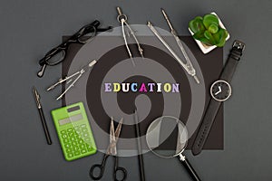 Education of architecture - black paper, text `Education` of wooden letters, engineering tools, magnifying glass, eyeglasses