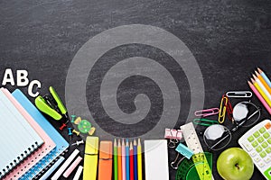 Education or back to school Concept. Top view of Colorful school supplies with books, color pencils, calculator, pen cutter clips