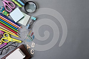 Education or back to school Concept. Top view of Colorful school supplies with books, color pencils, calculator, pen cutter clips