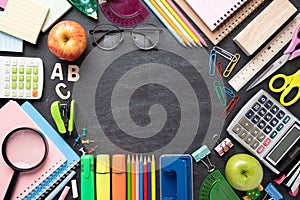 Education or back to school Concept. Top view of Colorful school supplies with books, color pencils, calculator, pen cutter clips