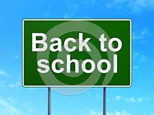Education concept: Back to School on road sign background