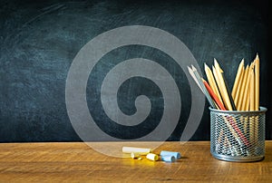 Education, Concept Back To School. School Supplies Border Banner front of chalkboard and Pencils in a steel box on wood table, Sta