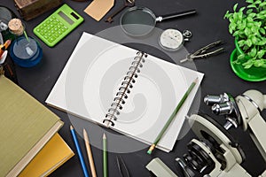 Education concept books and microscope on the desk in the auditorium
