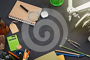 Education concept books and microscope on the desk in the auditorium