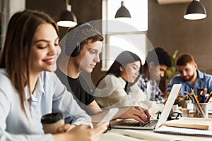 Education concept. College students studying in campus library