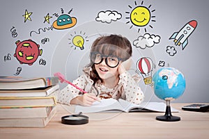 Education concept , cute little happy girl at school making homework with creativity