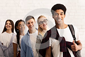 Education concept. Happy teens smiling to camera photo
