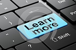 Education concept: Learn More on computer keyboard background