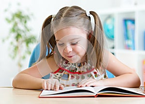 Education concept - little student kid reading