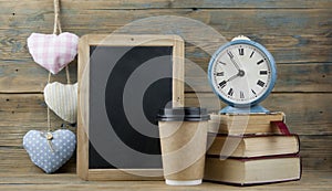 Education concept. Online education course. Books and disposable cup on wooden surface