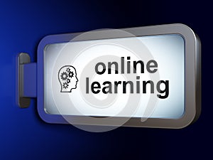 Education concept: Online Learning and Head With Gears on billbo