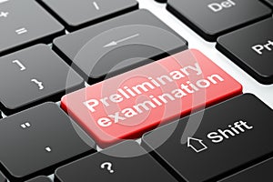 Education concept: Preliminary Examination on computer keyboard background