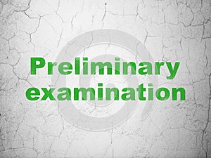 Education concept: Preliminary Examination on wall background