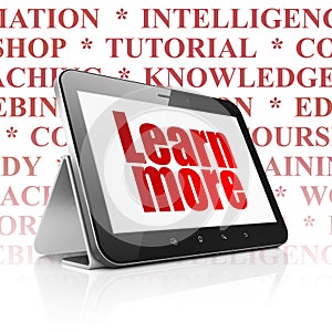 Education concept: Tablet Computer with Learn More on display