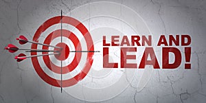 Education concept: target and Learn and Lead! on wall background