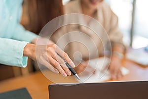 Education concept, Teenage girl pointing on laptop to asking question tutor while study tutorial