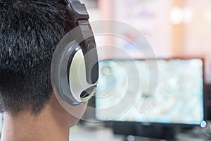 Education e-learning foreign languages Concept : Asian Student Young man wearing Headphones listening English songs music and