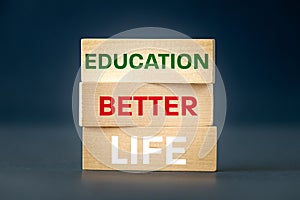 education equals a better life, Concept, written words, better life education, on wooden blocks, Motivating slogan, beautiful navy
