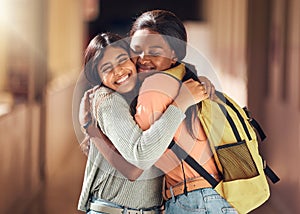 Education, friends and hug with women in college for learning, scholarship and happiness. Embrace, bonding and affection
