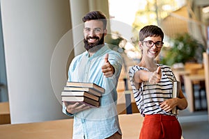 Education friendship people concept. Group of happy students learning together in college library