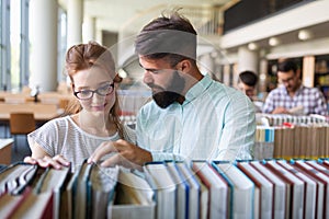 Education friendship people concept. Group of happy students learning together in college library