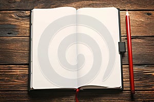 Education and goal setting concept notepad and red pencil arrangement