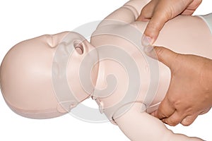 Education healthcare first aid of CPR training medical procedure of a newborn, demonstrating chest compression on CPR doll ,