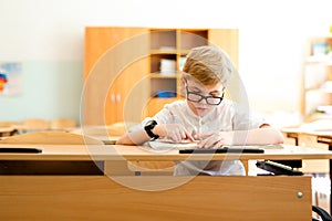 Education, high school, college. Portrait of a funny shouting student boy standing by a school blackboard