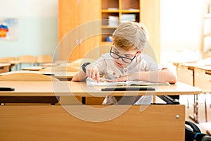 Education, high school, college. Portrait of a funny shouting student boy standing by a school blackboard