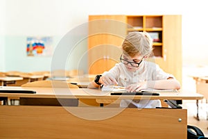 Education, high school, college. Portrait of a funny shouting student boy standing by a school blackboard