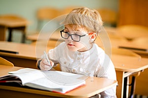 Education, high school, college. Portrait of a funny shouting student boy standing by a school blackboard