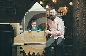 Education and kid idea development. Family and childhood. Earth day concept. father day. Father and small boy in paper