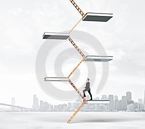 Education ladder concept with businessman climbs up the stairs