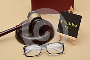 Education Law sign with wood gavel and glasses