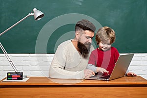Education and learning people concept - little student boy and Teacher. Young adult concept. Happy family. Parent