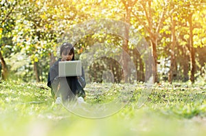 Education Learning Studying concept : Attractive Happy Asian Young girl enjoy searching, social with laptop for preparing final