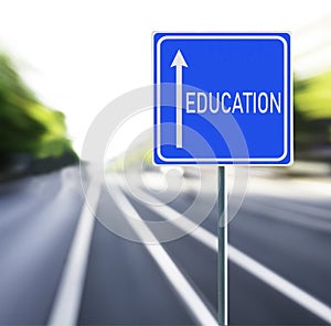 Education Road Sign on a Speedy Background.