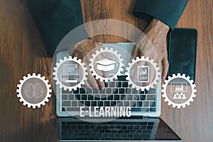 Education online e learning with connected gear icons.Hand using laptop design concept. Top view