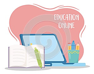 Education online, laptop open book pen and stationery objects