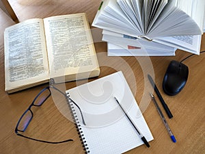 Education process. Reading monographs, scientific literature, note-taking, educational process, online learning.