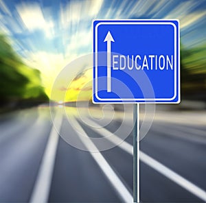 Education Road Sign on a Speedy Background with Sunset.