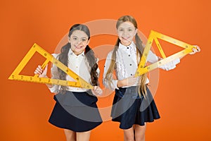 Education and school concept. School students learning geometry. Kids school uniform on orange background. Pupil cute