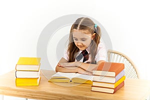Education and school concept - smiling little student girl with many books at school