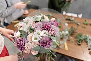 Education in the school of floristry. Master class on making bouquets. Summer bouquet. Learning flower arranging, making