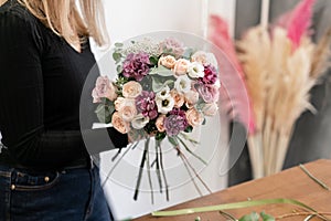 Education in the school of floristry. Master class on making bouquets. Summer bouquet. Learning flower arranging, making