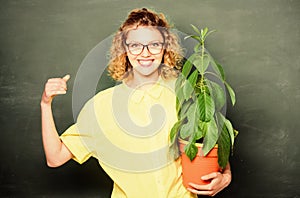 Education. school nature study. happy student girl with plant at blackboard. environmental education. teacher woman in