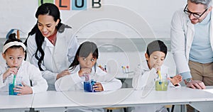 Education, science and kids in class for an experiment while learning chemistry together at school. Study, laboratory