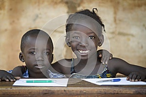 Education Symbol: Couple of African Children Smiling at School