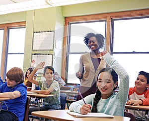 Education, teacher and kids raise their hands to ask or answer an academic question for learning. Diversity, school and